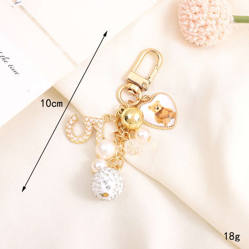 Pearl Bow Pendant Headphone Case Keychain Keychain Designer Accessory Chain Jewelry Accessories