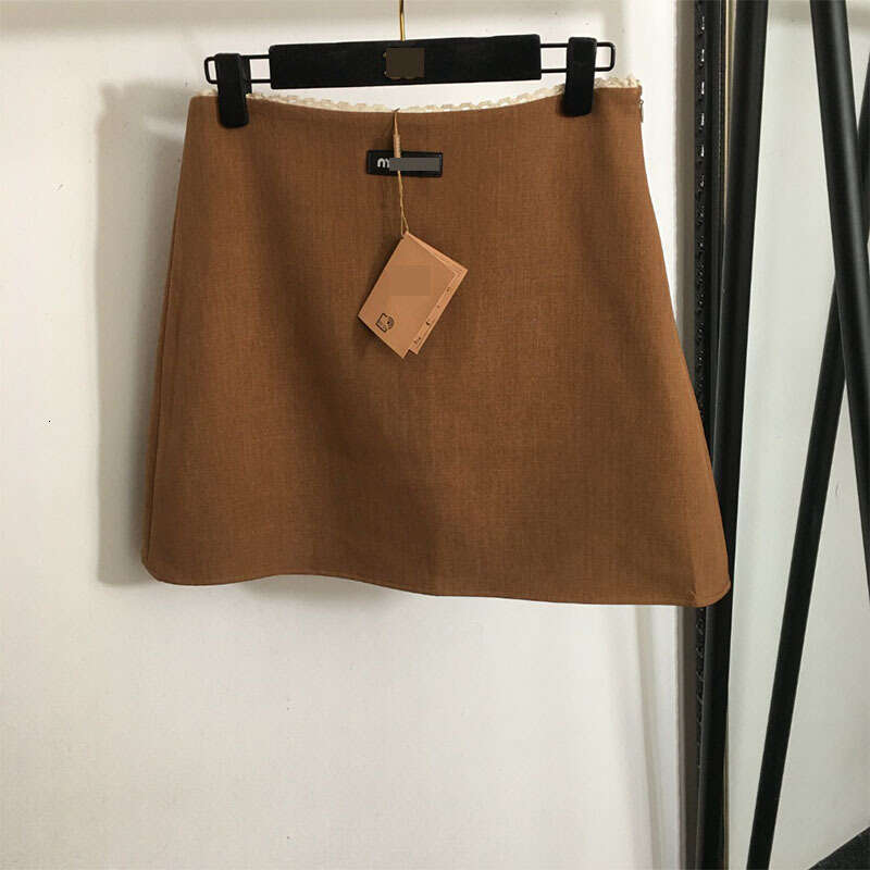 Designer 2025 Spring Foreign Trade New Versatile Leather Label Letter A-Line Niche Design Lace Short Half Bodycon Skirt 7646 61a6