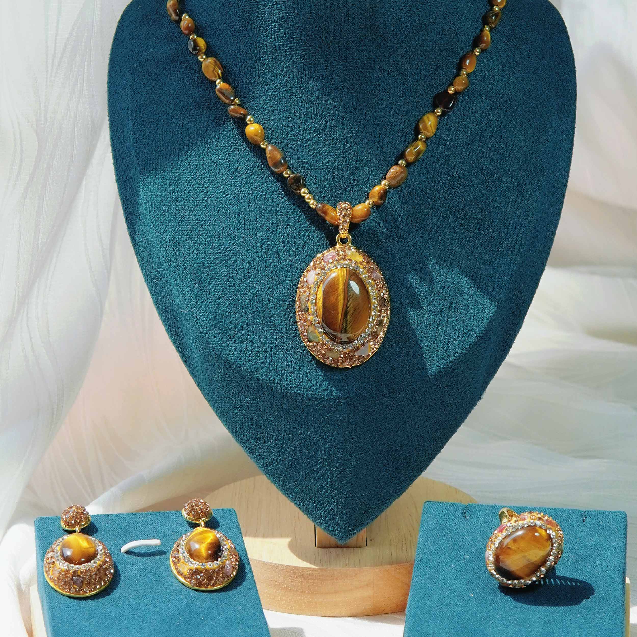 Kun Yuan is a natural tiger eye stone energy jewelry set light and luxurious natural tourmaline high fashion ring earrings necklace.