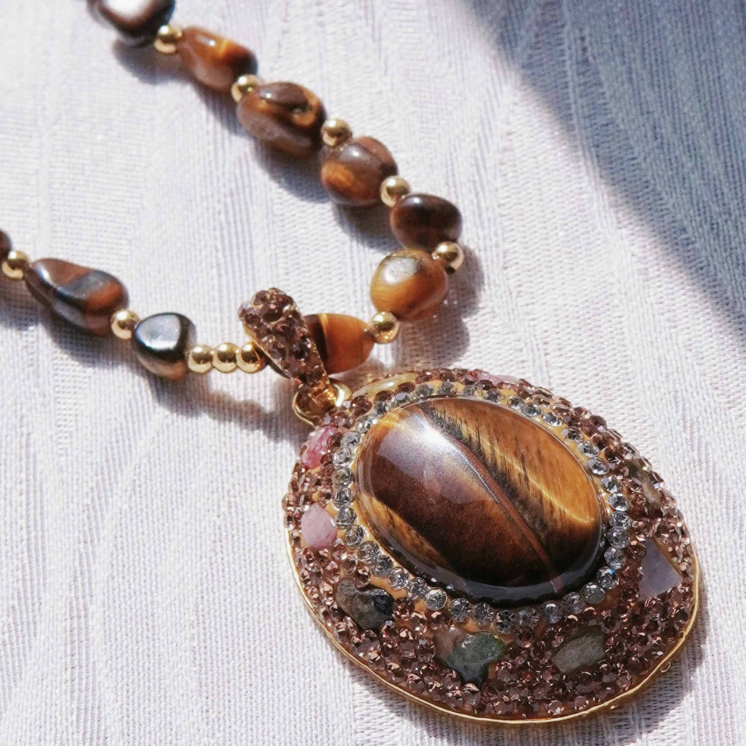 Kun Yuan is a natural tiger eye stone energy jewelry set light and luxurious natural tourmaline high fashion ring earrings necklace.