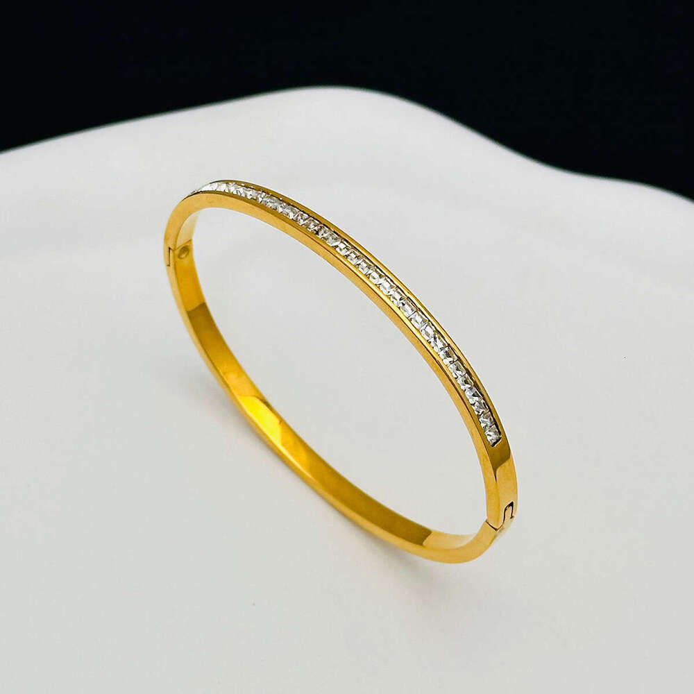 DHCollections Elegant Crystal Bangle Bracelet Stainless Steel Luxe Star inspired Stackable Cuff for Women