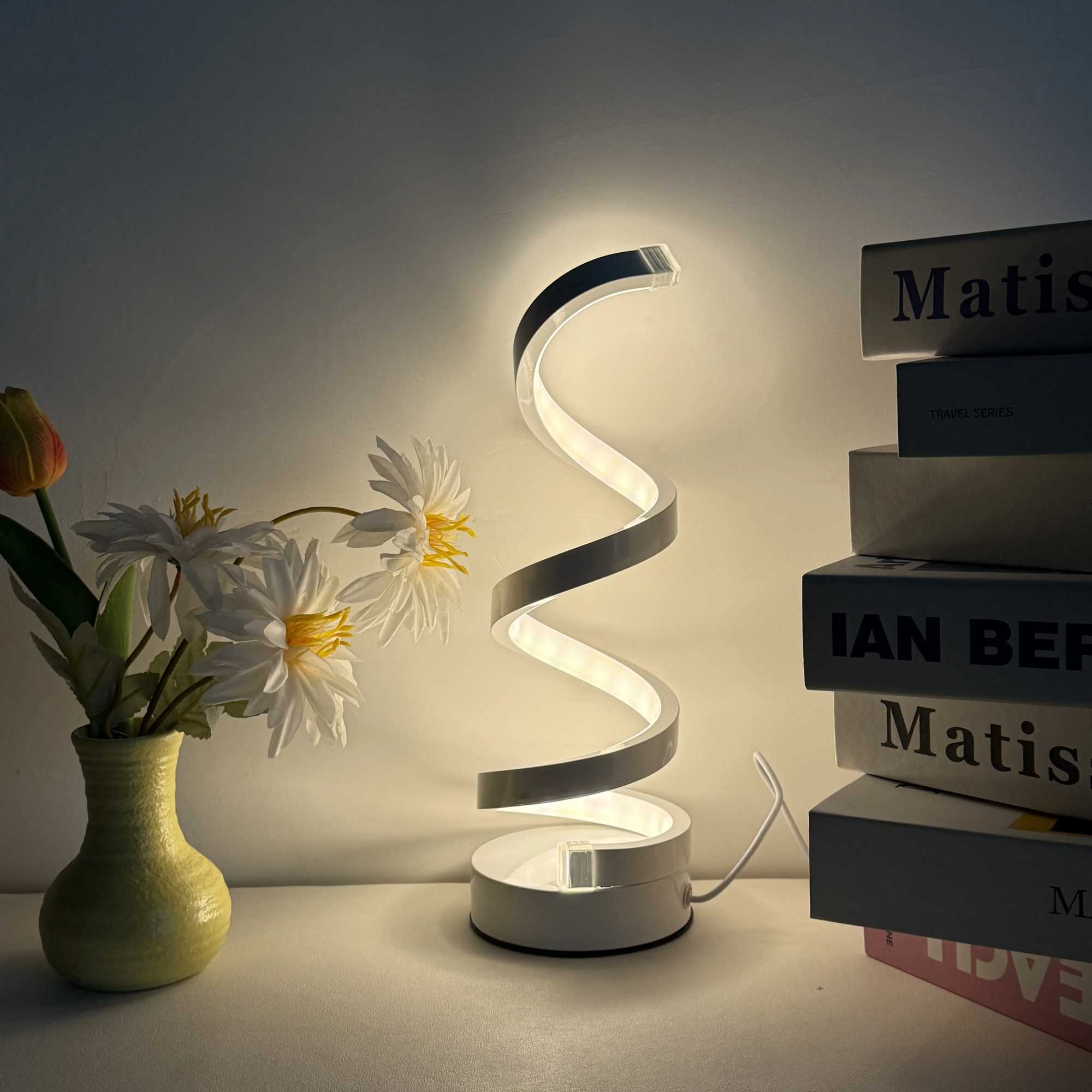 Modern elegant white spiral desktop lamp powered by USB with three-color dimming suitable for various types of rooms. XJ250703