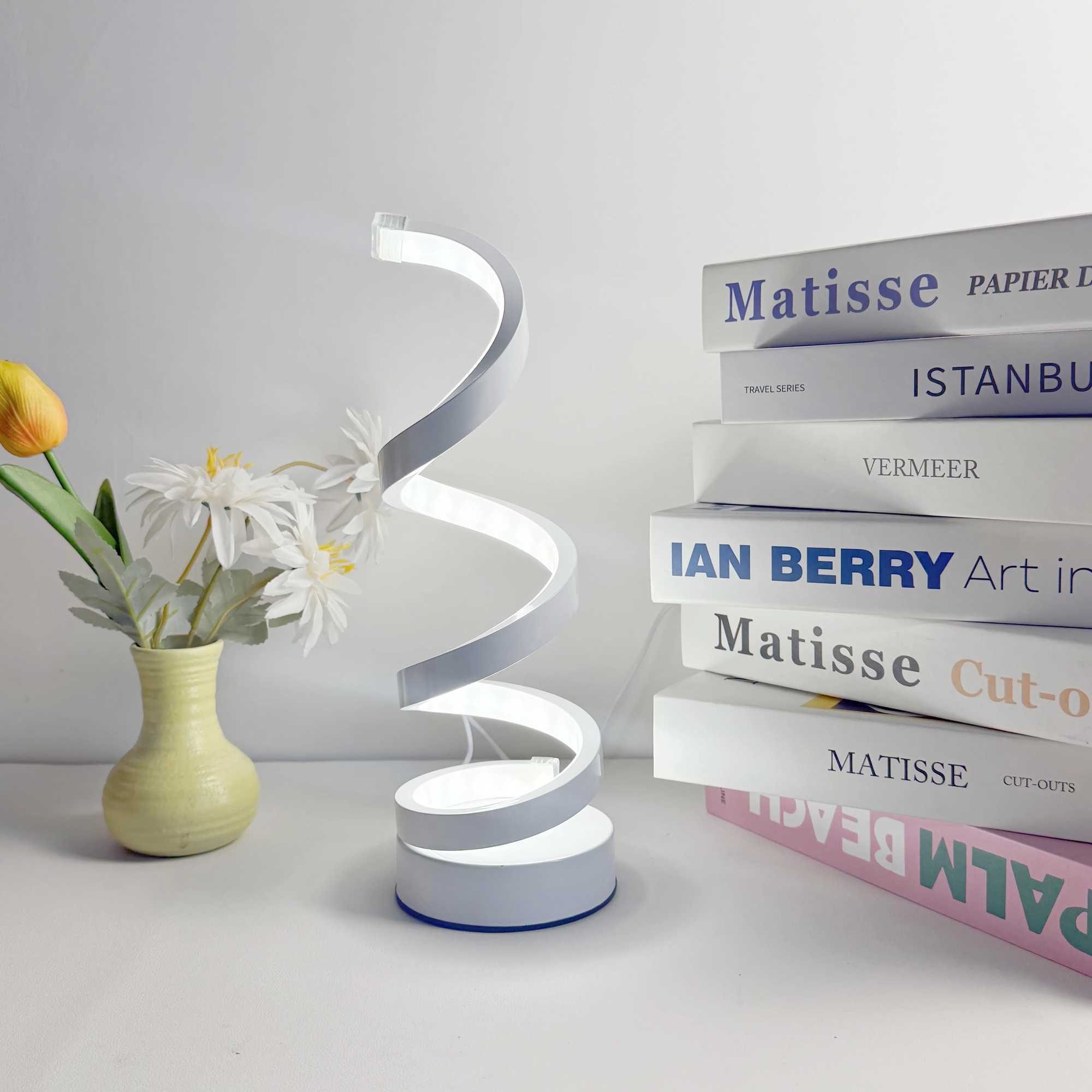 Modern elegant white spiral desktop lamp powered by USB with three-color dimming suitable for various types of rooms. XJ250703