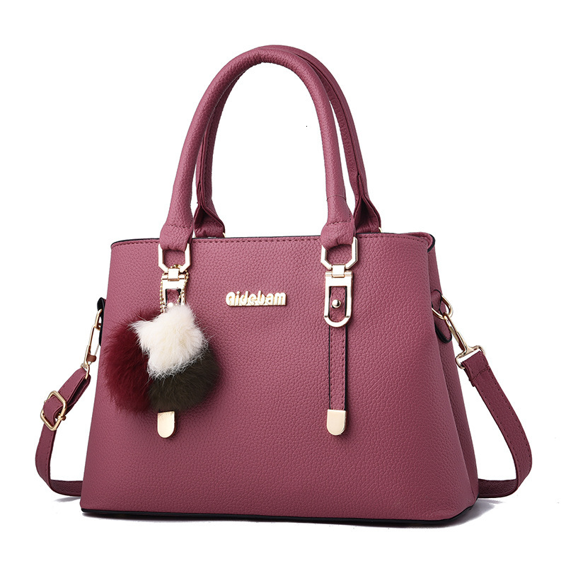 Designer's 2025 New European And American Fashion Large Capacity Women's Handbag Pom Pom Single Shoulder Crossbody Bag Wholesale Free Shippi