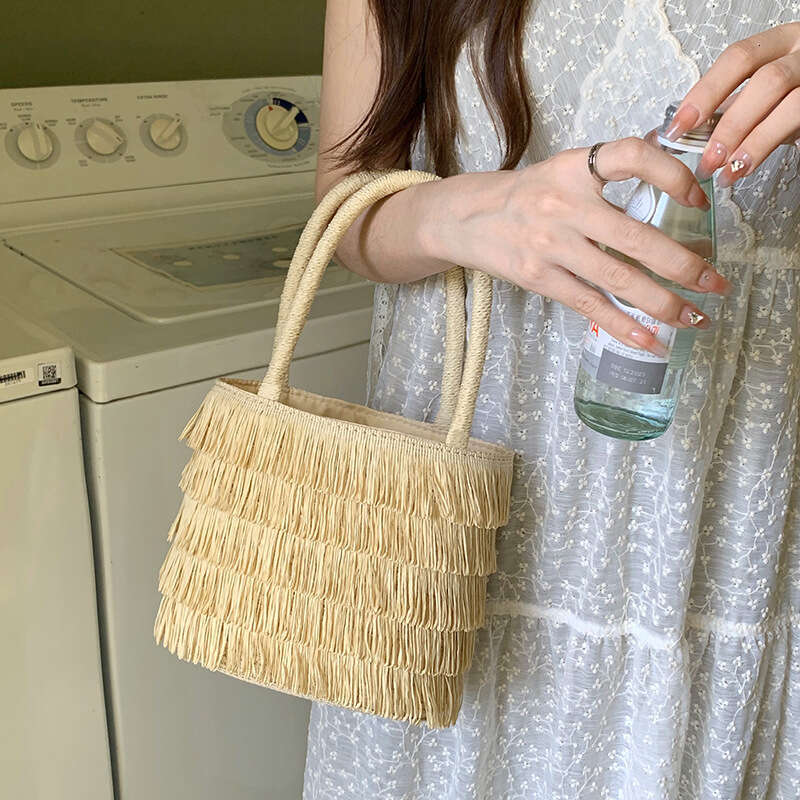 Pastoral Style Handmade Straw Handbag for Women Summer 2025 New French Beach Tassel Woven Bag