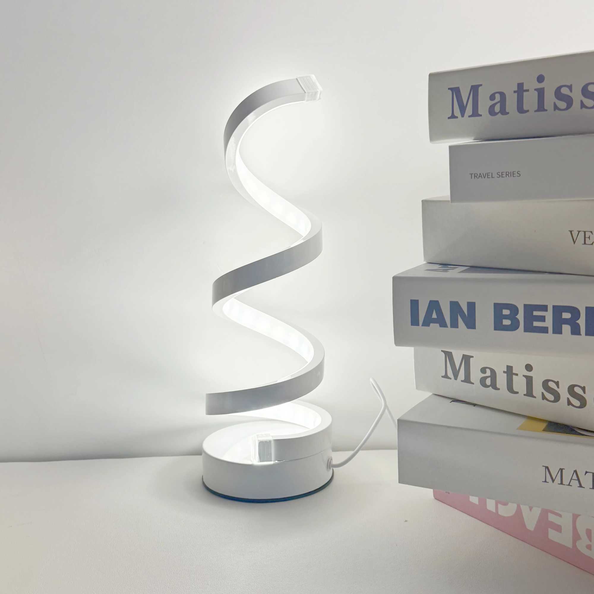 Modern elegant white spiral desktop lamp powered by USB with three-color dimming suitable for various types of rooms. XJ250703