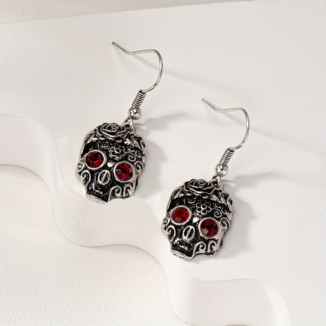 A Pair Of Cute Hip-Hop Red-Eyed Skull Pendant Earrings With Flower Pattern