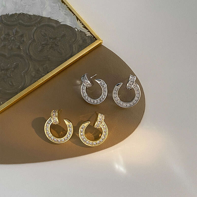 DHCollections Stylish Hoop Earrings Dazzling Metal Round Shape Statement Jewelry For Women