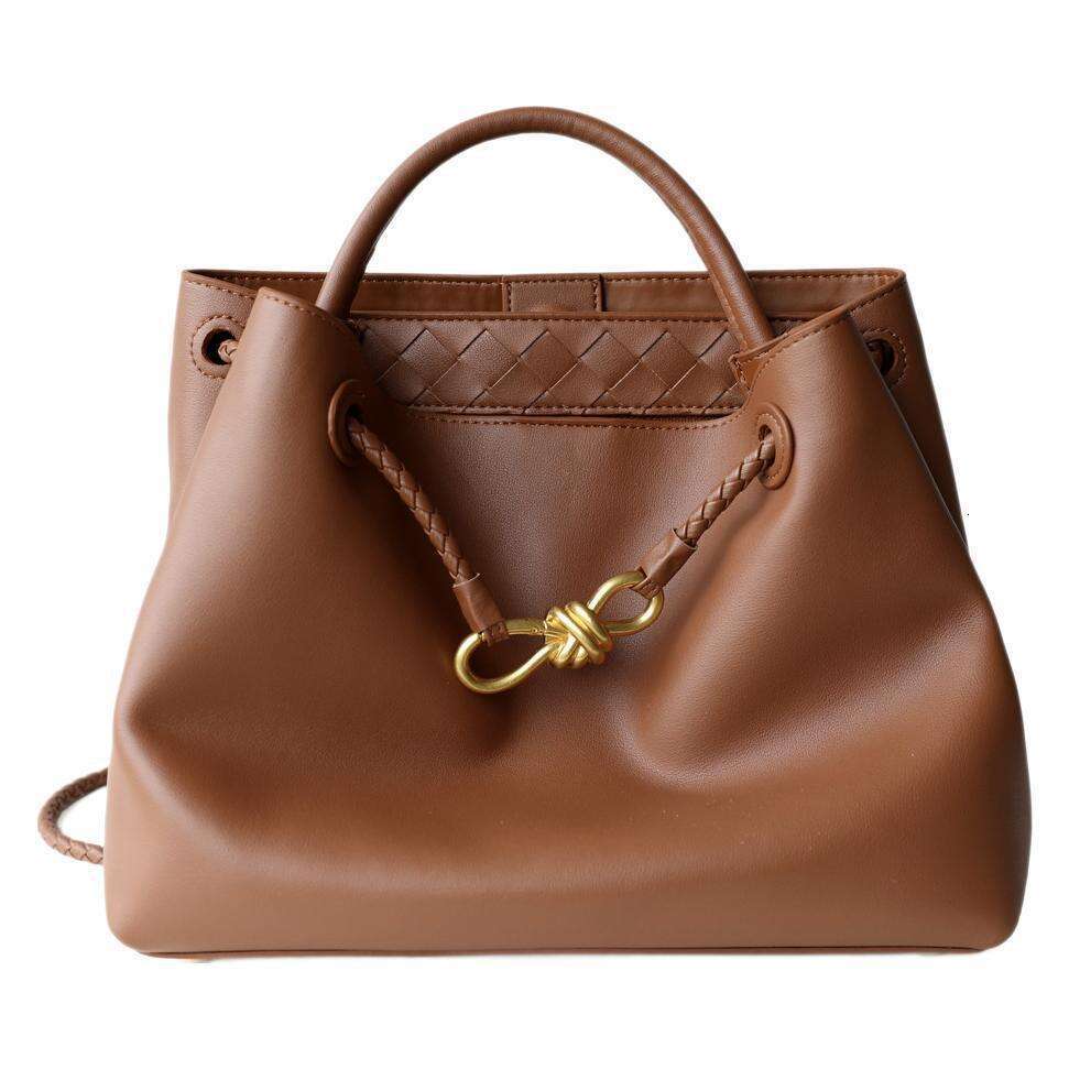 Luxury designer niche spring and summer new leather women's metal bow handheld large-capacity shoulder tote bag