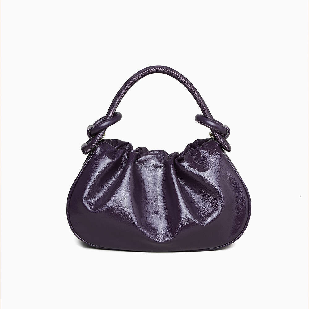Luxury designer Crystal Wax cowhide portable autumn and winter high-end hand slung commuter Joker jiaozi handbag.
