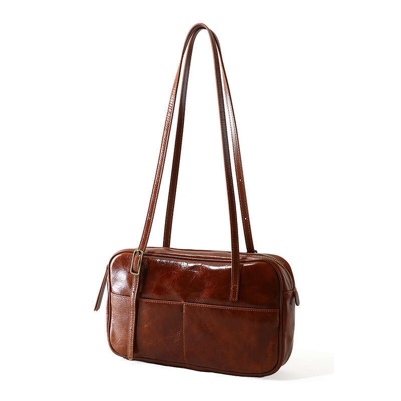 Luxury designer new ladies personality fashion authentic portable waxed leather commuting armpit Korean style large-capacity shoulder bag.