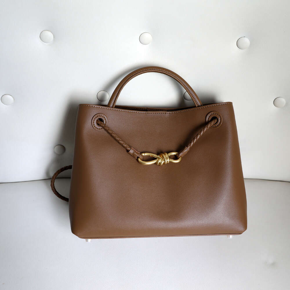 Luxury designer niche spring and summer new leather women's metal bow handheld large-capacity shoulder tote bag