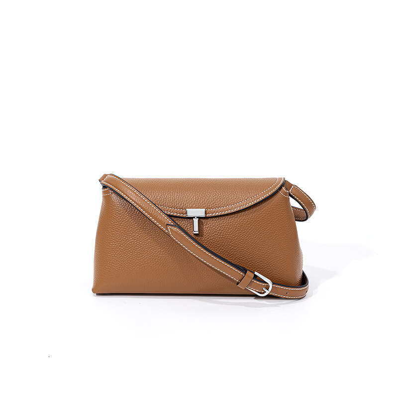 Luxury designer new niche simple top layer cowhide flip T-lock fashion commuter slung large capacity shoulder bag.