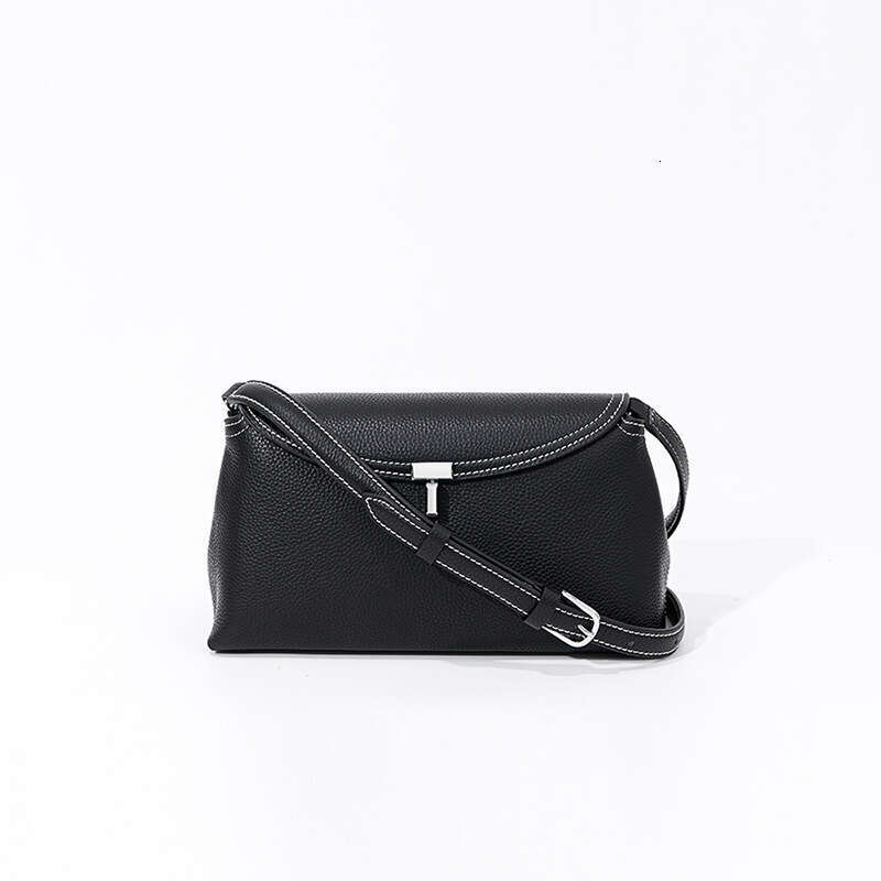 Luxury designer new niche simple top layer cowhide flip T-lock fashion commuter slung large capacity shoulder bag.