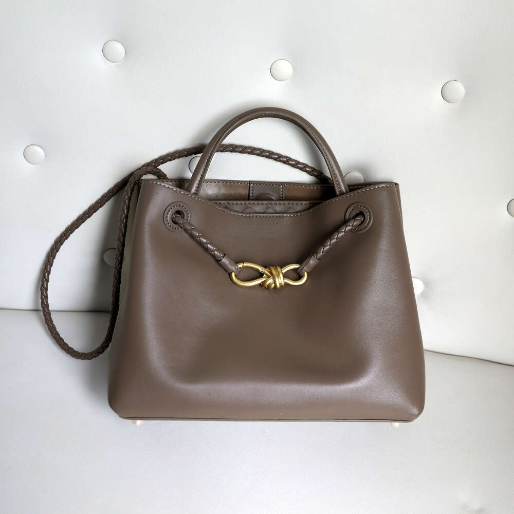 Luxury designer niche spring and summer new leather women's metal bow handheld large-capacity shoulder tote bag