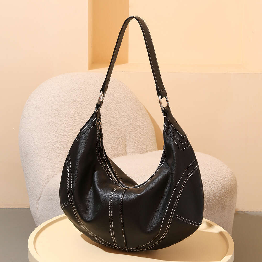 Luxury designer first layer cowhide ladies daily commuting shopping travel high-end hand bill shoulder crossbody bag.
