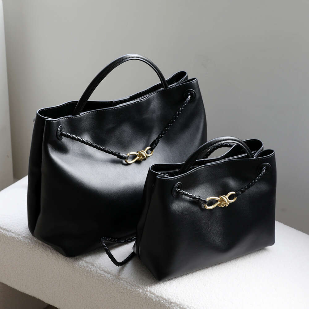 Luxury designer niche spring and summer new leather women's metal bow handheld large-capacity shoulder tote bag