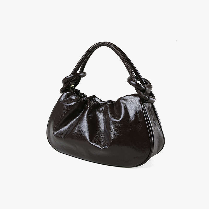 Luxury designer Crystal Wax cowhide portable autumn and winter high-end hand slung commuter Joker jiaozi handbag.