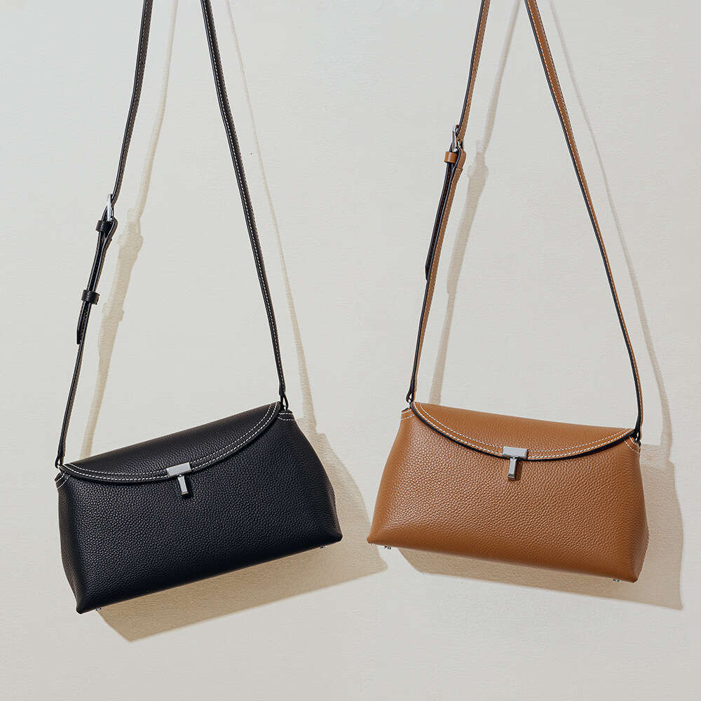 Luxury designer new niche simple top layer cowhide flip T-lock fashion commuter slung large capacity shoulder bag.