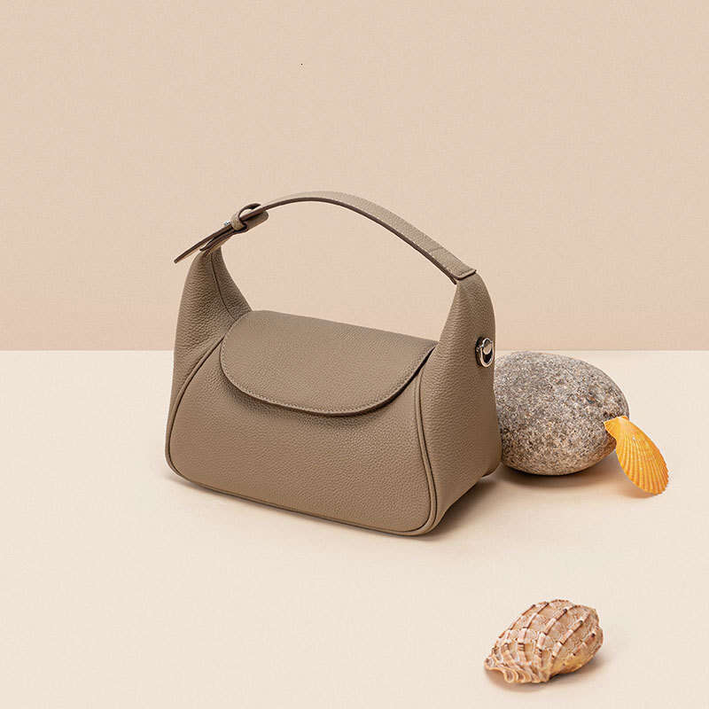 Luxury first layer cowhide niche design portable toast pillow new simple lady shoulder crossbody bag