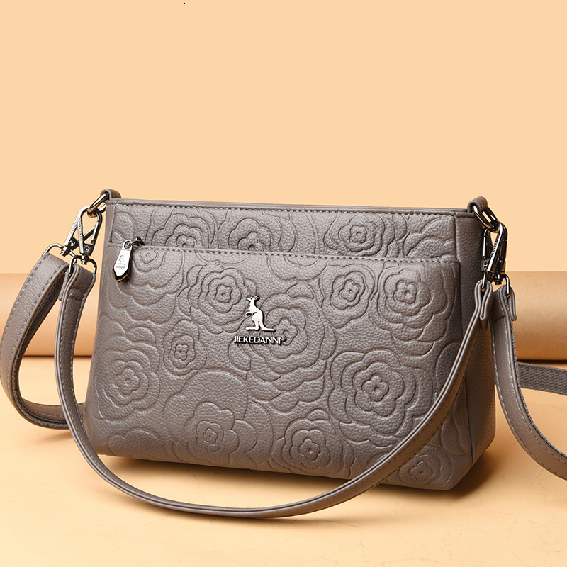 Free Shipping 2025 Designer's New Women's Kangaroo Shoulder Crossbody Bag, Simple And Multifunctional Embossed Middle-aged Women's Moth