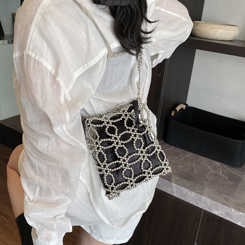 Free shipping designer Fashionable and Beautiful Spring/Summer Hollow Pearl Chain Woven Bag for Women 2025 New High-End Crossbody Bag Phone Bag