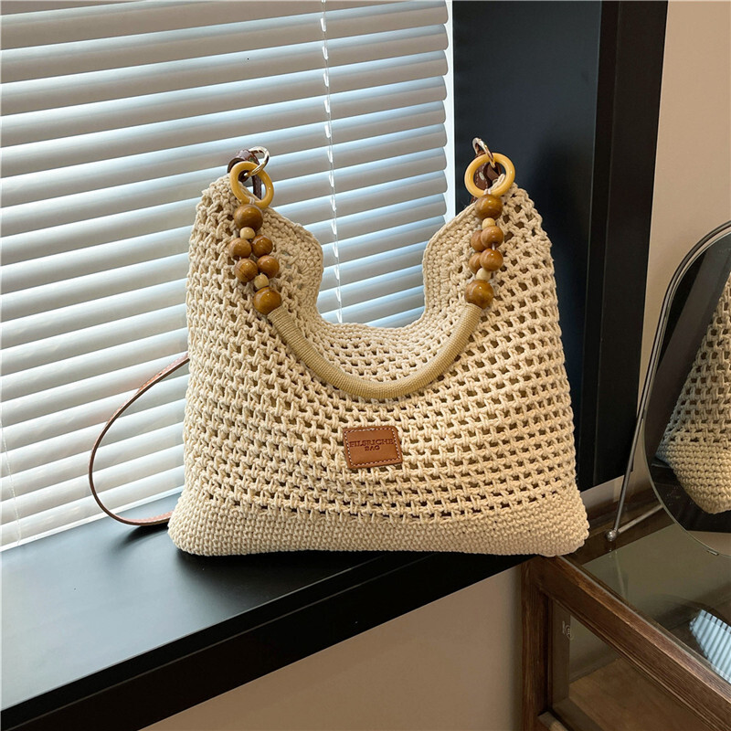 Free shipping designer Beach Vacation Beach Woven Bag for Women 2025 New Summer Hollow Knitted Handbag Large Capacity Shoulder Bag Straw Bag