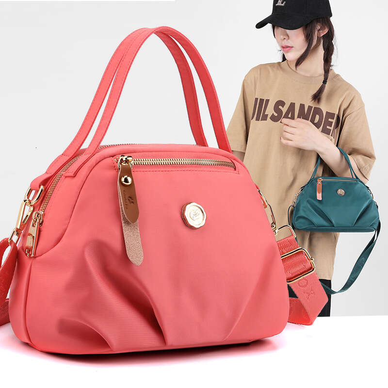 New shoulder bag women's hand-held dumpling bag mobile phone bag large capacity fashionable and casual