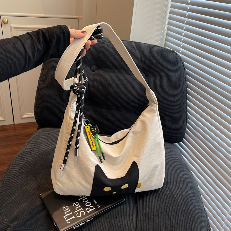 Free shipping designer Casual Cute Lightweight Cat Canvas Bag for Women 2025 New Large Capacity Commuter Tote Bag High-end Feel Shoulder Bag