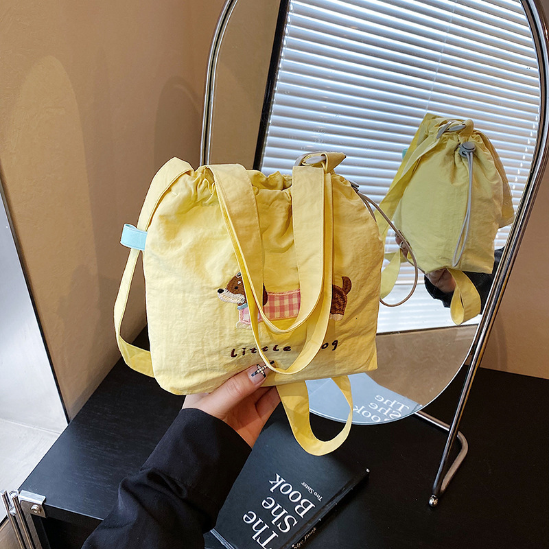 Free shipping designer Summer High-End Commuting Phone Crossbody Bag Small Bag for Women 2025 New Versatile Cute Embroidered Drawstring Canvas Bag