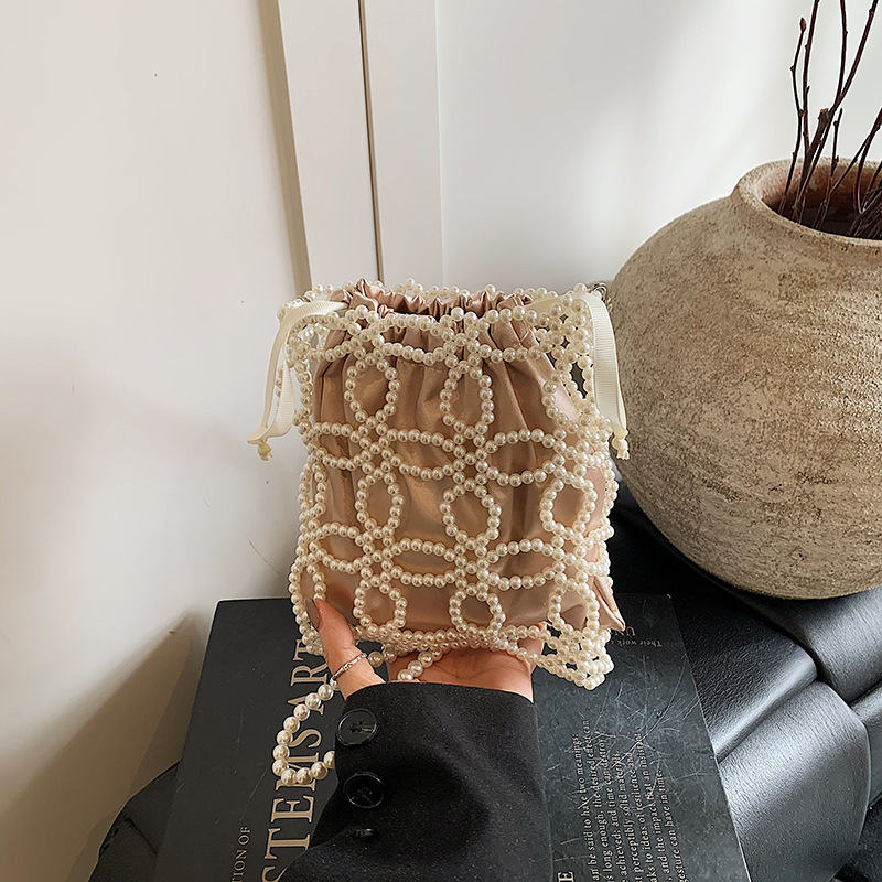 Free shipping designer Fashionable and Beautiful Spring/Summer Hollow Pearl Chain Woven Bag for Women 2025 New High-End Crossbody Bag Phone Bag