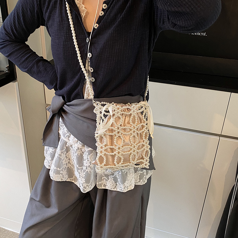 Free shipping designer Fashionable and Beautiful Spring/Summer Hollow Pearl Chain Woven Bag for Women 2025 New High-End Crossbody Bag Phone Bag