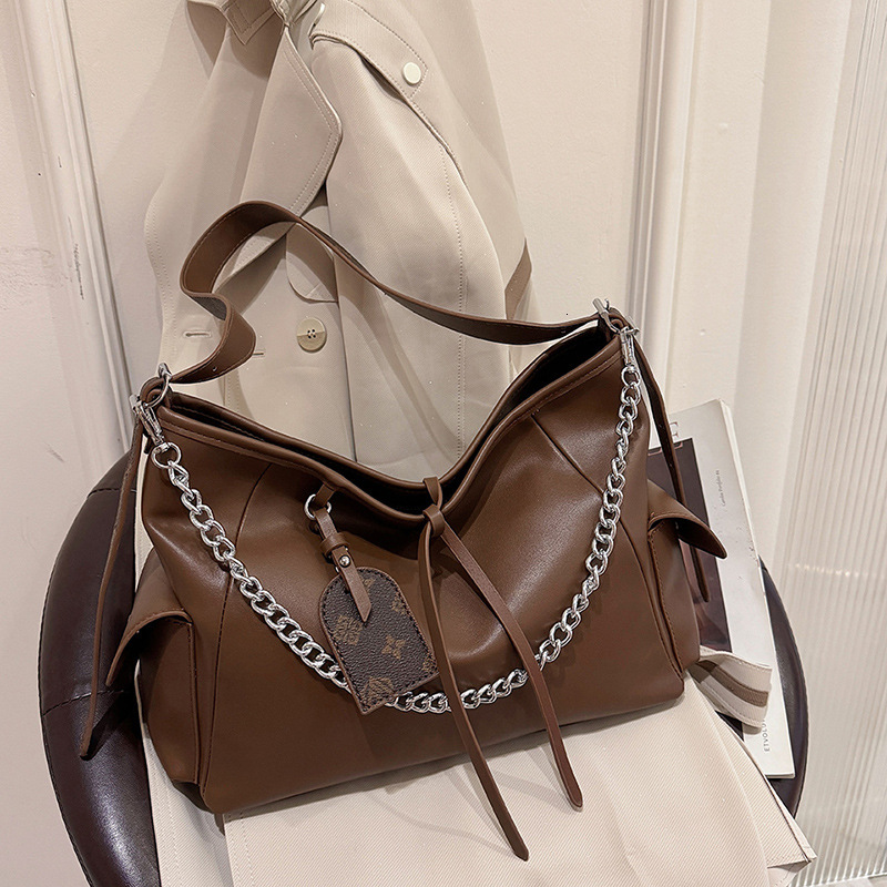 Free shipping designer Large Capacity Bag for Women New Design Bowknot Motorcycle Underarm Bag Black Commuting Bag Trendy