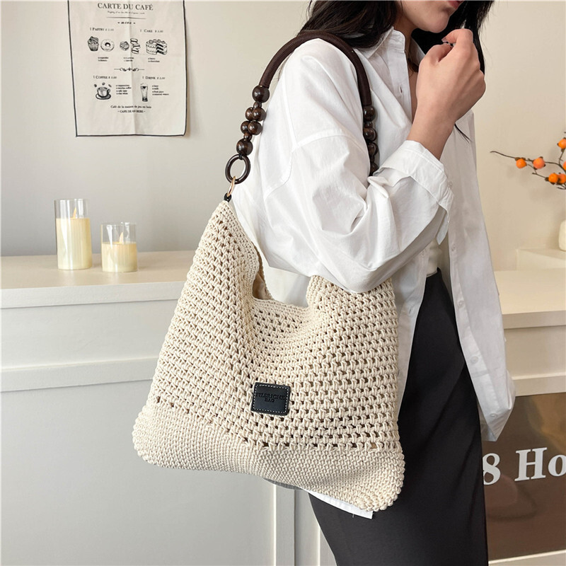 Free shipping designer Beach Vacation Beach Woven Bag for Women 2025 New Summer Hollow Knitted Handbag Large Capacity Shoulder Bag Straw Bag