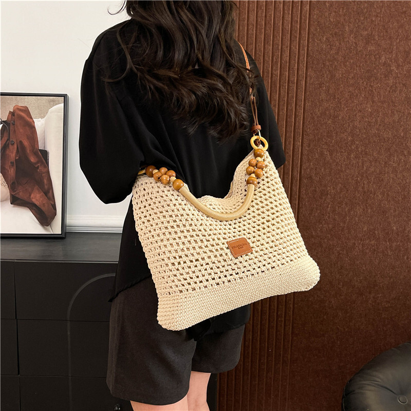 Free shipping designer Beach Vacation Beach Woven Bag for Women 2025 New Summer Hollow Knitted Handbag Large Capacity Shoulder Bag Straw Bag