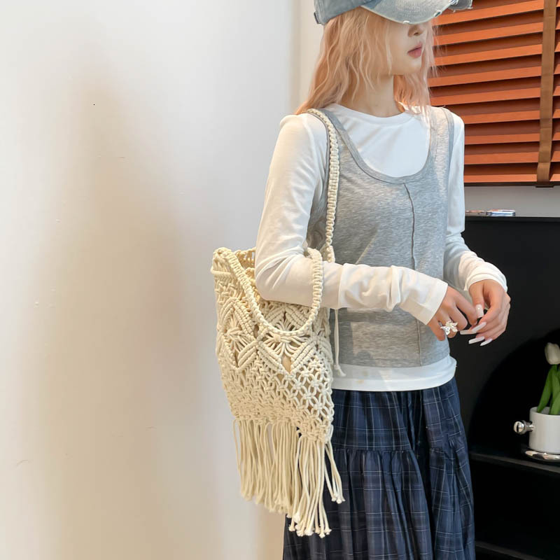 Free shipping designer Summer Cotton Woven Bag for Women 2025 New Hollow Tassel Phone Bag Beach Vacation Crossbody Small Bag
