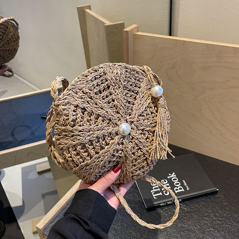 Free shipping designer Woven Small Bag for Women 2025 New Summer Tassel Straw Bag Beach Vacation Shoulder Bag Crossbody Bag Small Round Bag