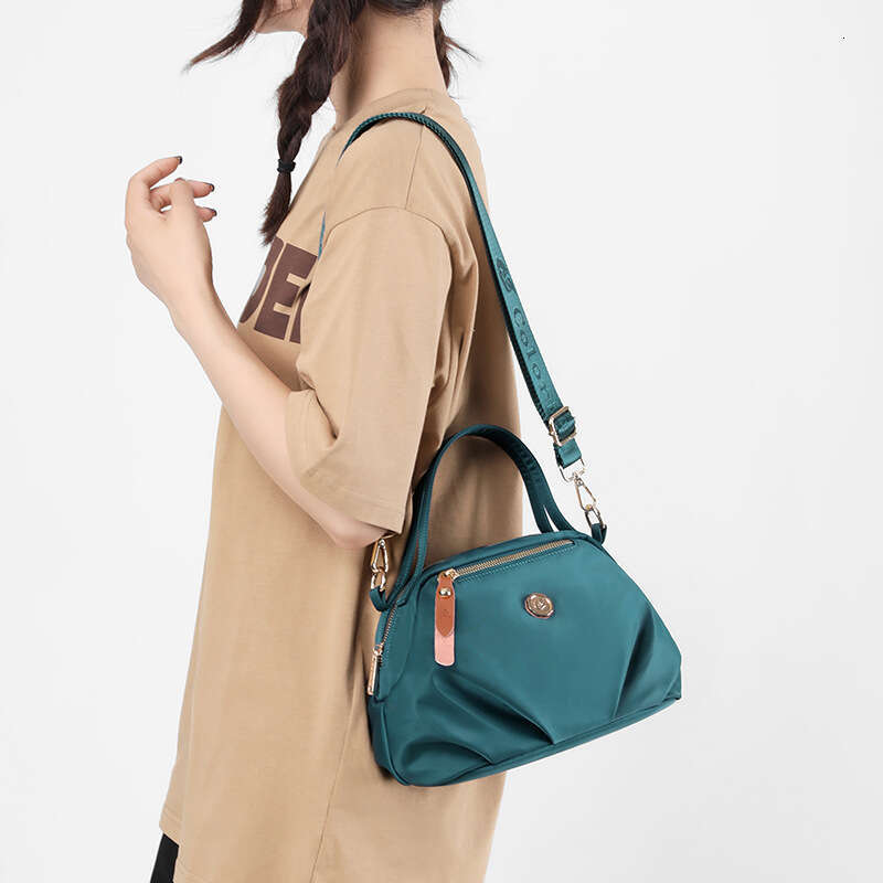New shoulder bag women's hand-held dumpling bag mobile phone bag large capacity fashionable and casual