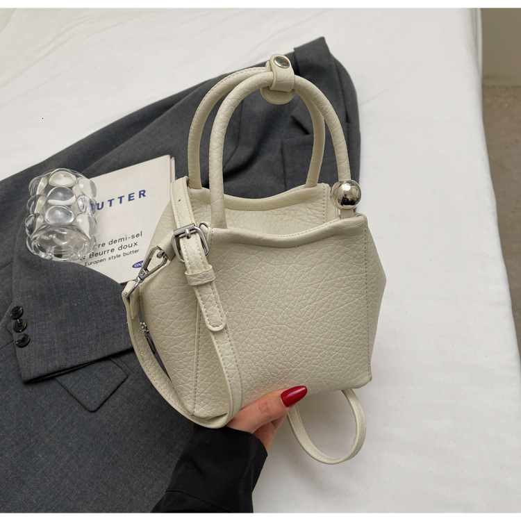 Free shipping designer Pink Handbag Small Tote Bag for Women 2025 New Spring Light Luxury Niche High-End Crossbody Bag Basket Bag Bucket Bag