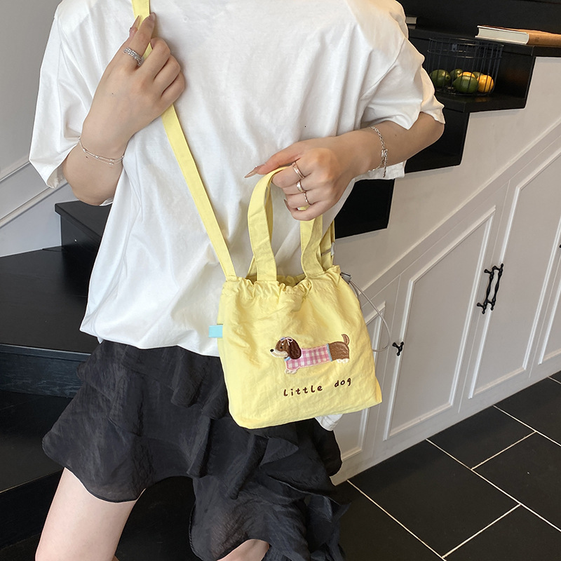 Free shipping designer Summer High-End Commuting Phone Crossbody Bag Small Bag for Women 2025 New Versatile Cute Embroidered Drawstring Canvas Bag
