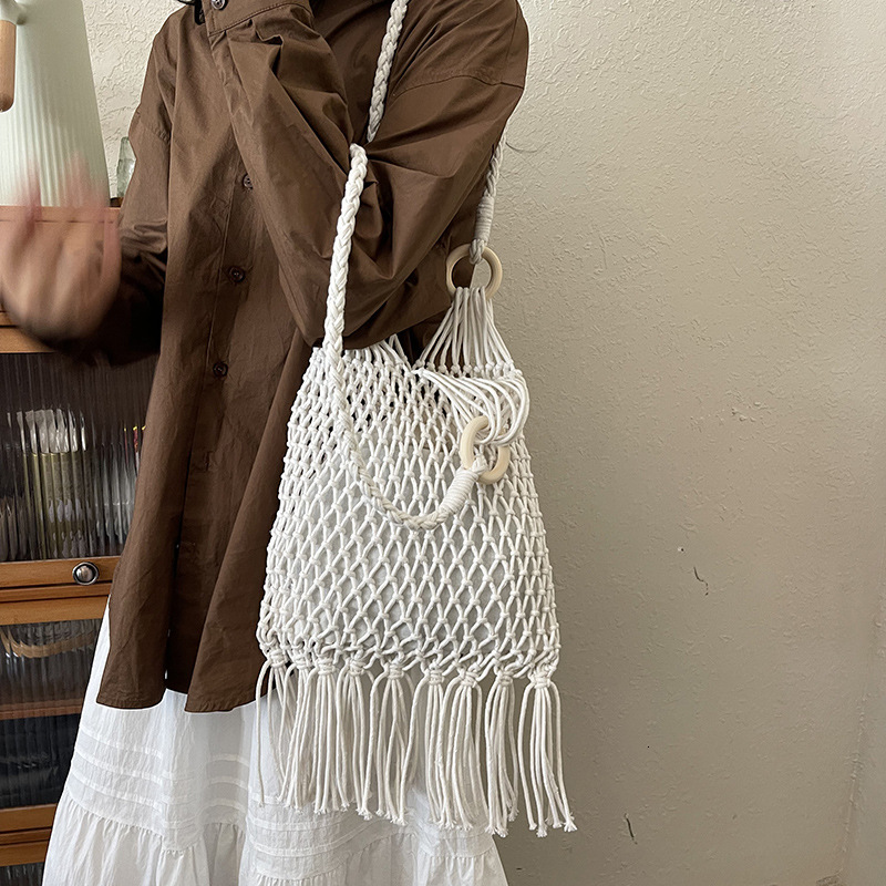 Free shipping designer New Cotton Thread Woven Bag Artistic Versatile Trendy Bag for Women Vacation Travel Casual Bag Fashion Hollow Shoulder Bag
