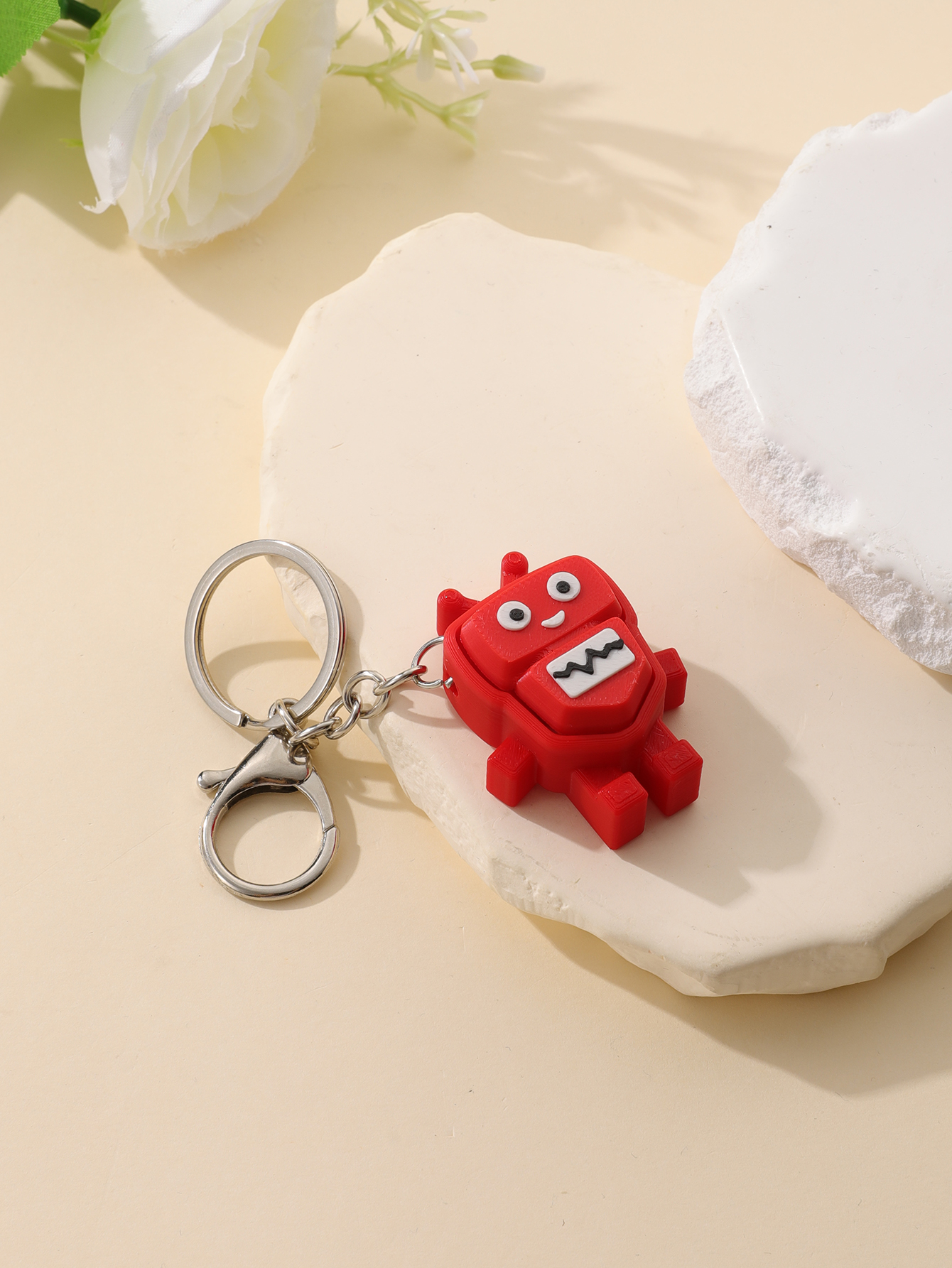 3D printed robot keychain - an adult stress relief toy with a portable anxiety-reducing gadget featuring a clickable keyboard design