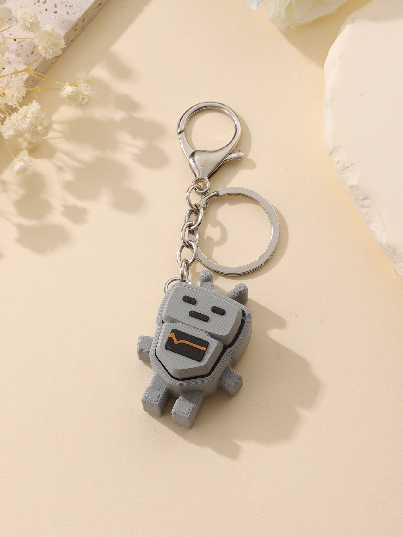 3D printed robot keychain - an adult stress relief toy with a portable anxiety-reducing gadget featuring a clickable keyboard design