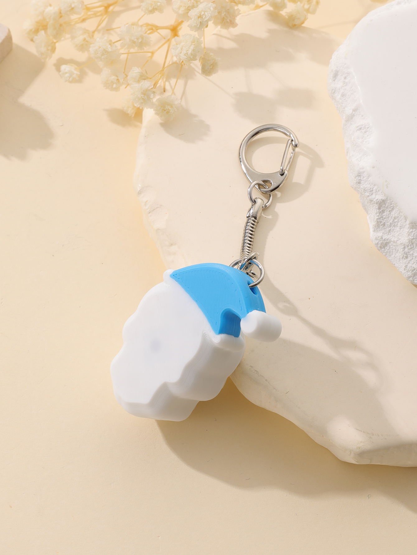 3D printed Christmas hat skull keychain - adult stress relief toy, with a portable anxiety relief gadget featuring a clickable keyboard design