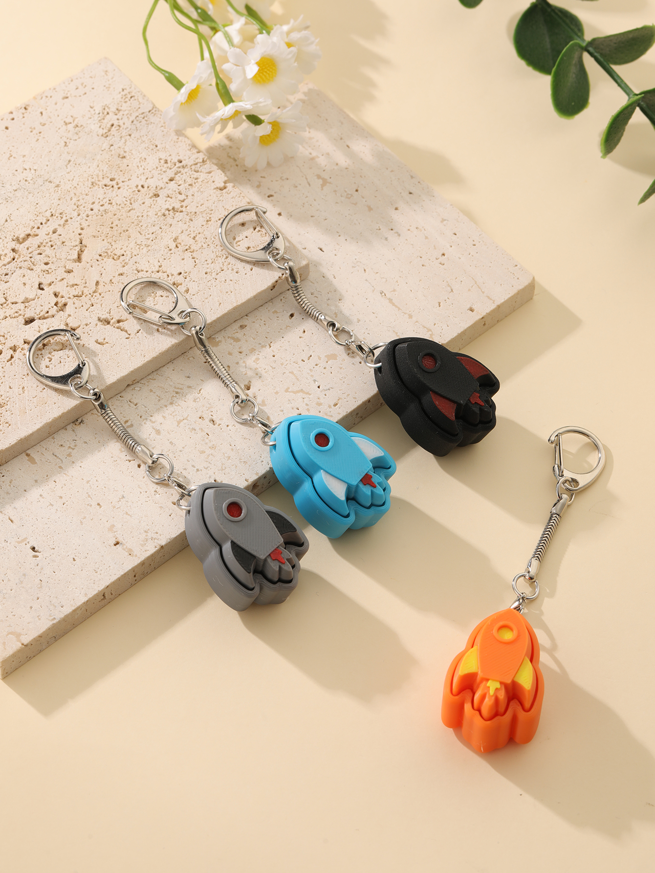 3D printed rocket keychain - an adult stress relief toy with a portable anxiety-reducing gadget featuring a clickable keyboard design