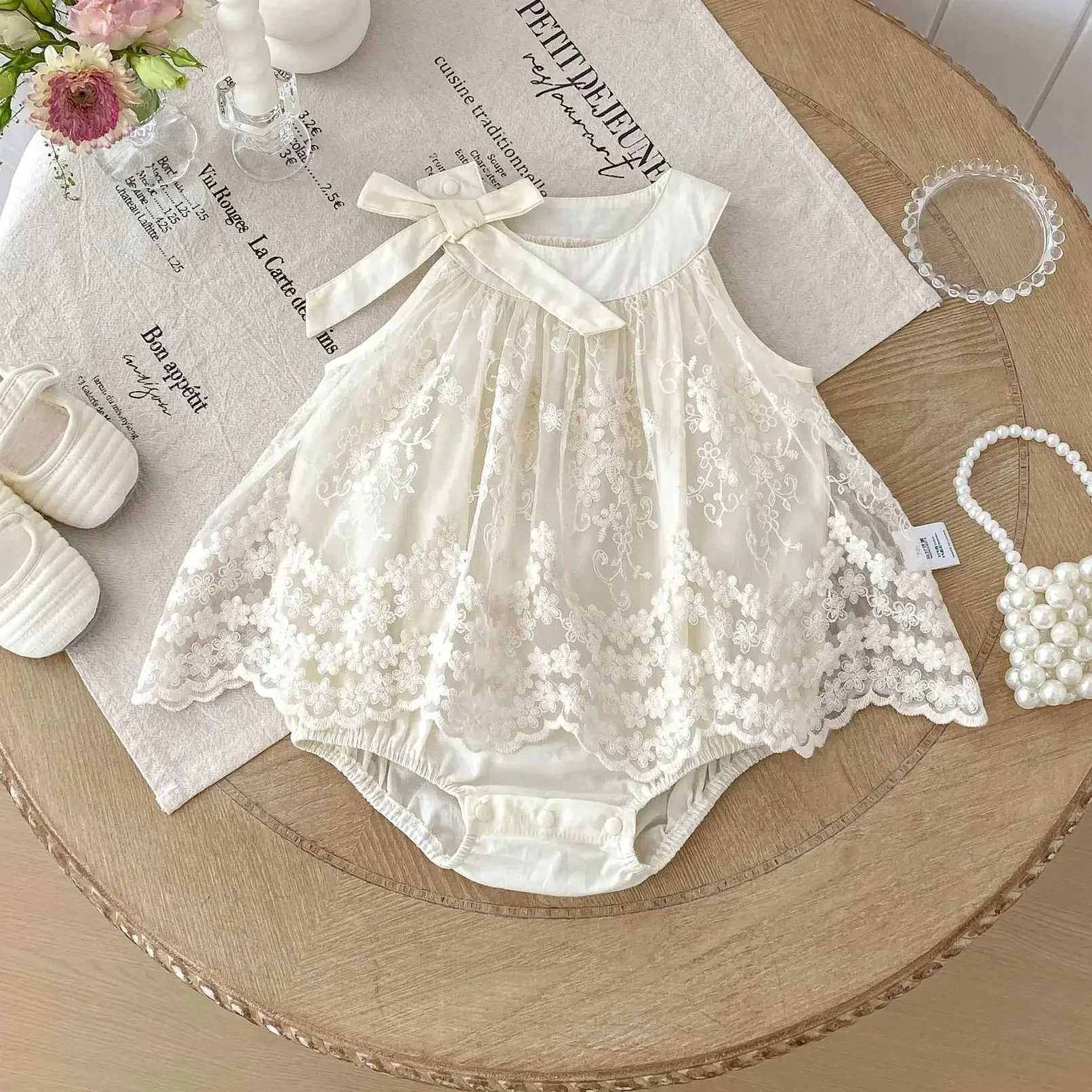 0-24M Infant Baby Girl Ivory Lace Embroidered Romper for Newborns Satin Bow Peter Pan Collar Sleeveless Onesie Baby Bodysuits R250707