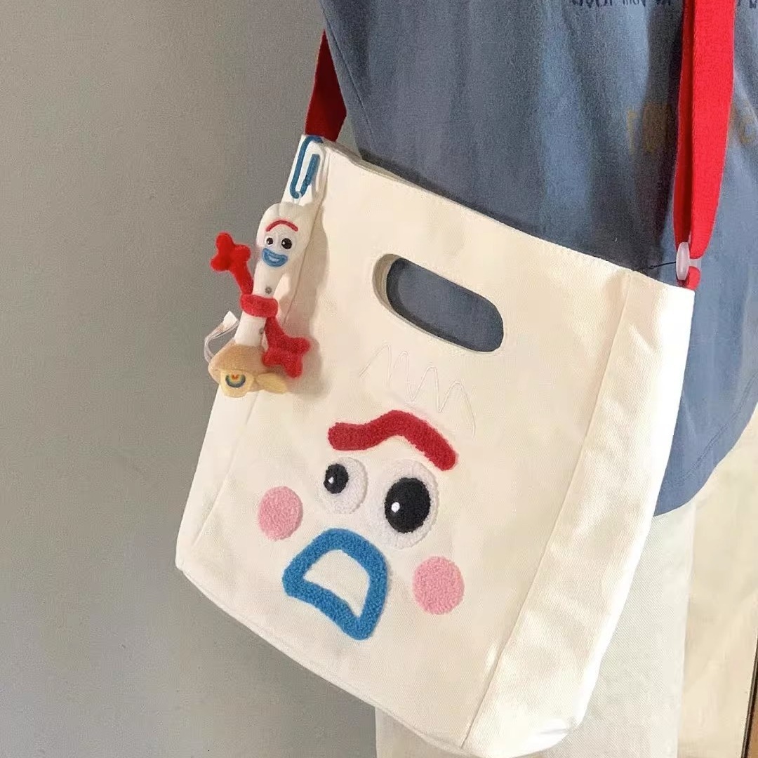 designer 2023 New Funny Expression Canvas Bag Women's Bag Large Capacity Handbag Ins Cute Casual Shoulder Crossbody Bag
