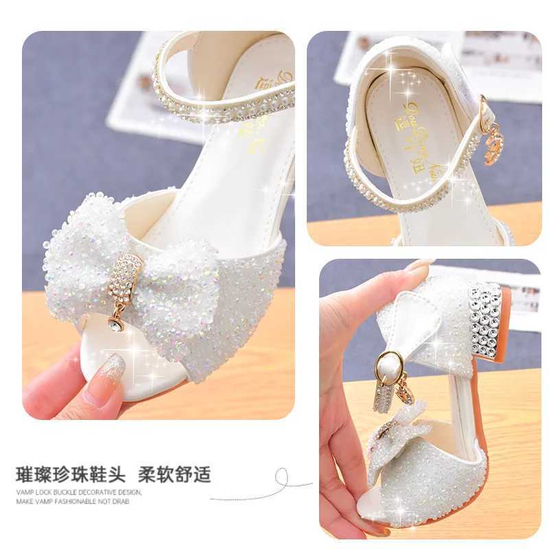 2025 New Childrens Summer Sandals Crystal Bowknot Girls High Heels Soft Sole White Princess Wedding Performance Shoes R250707