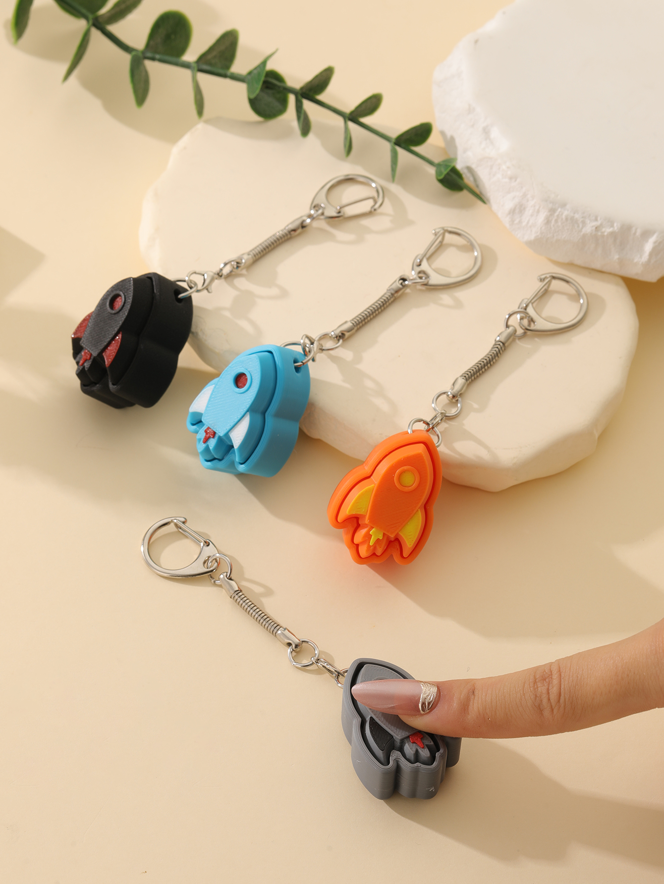 3D printed rocket keychain - an adult stress relief toy with a portable anxiety-reducing gadget featuring a clickable keyboard design