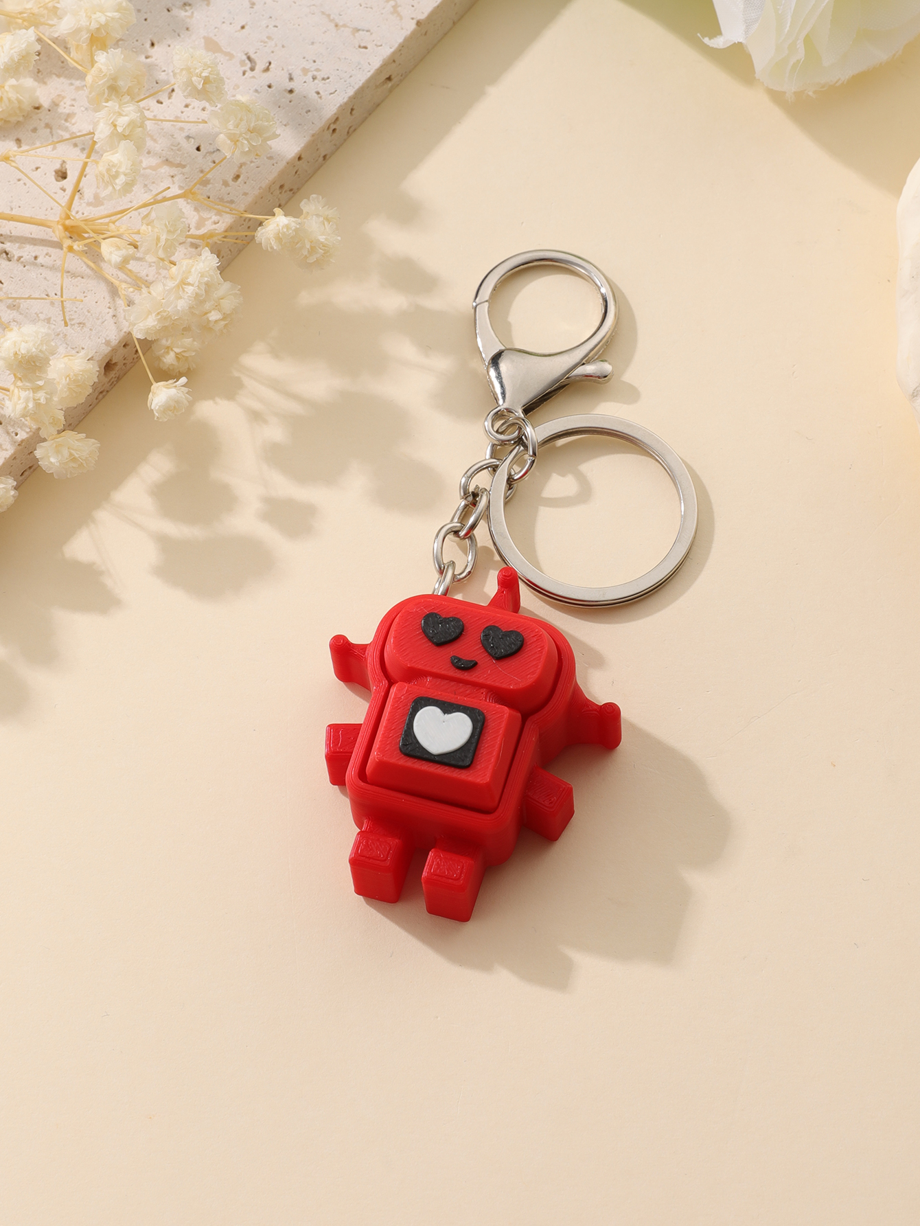 3D printed robot keychain - an adult stress relief toy with a portable anxiety-reducing gadget featuring a clickable keyboard design